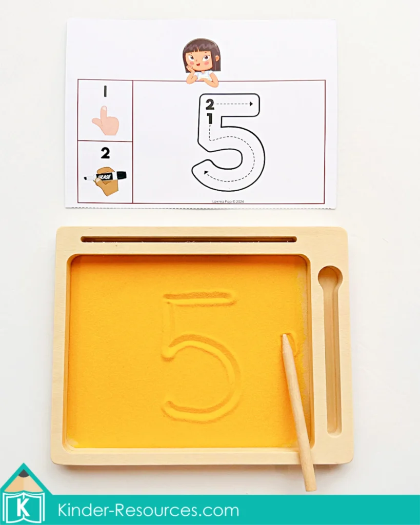 Preschool number tracing activity with sand tray cards for correct numeral formation. Download FREE sample pages on the blog!