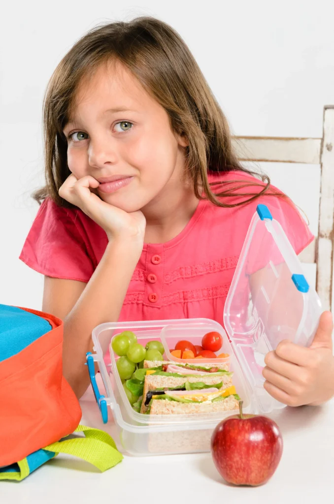 Child opening lunch box