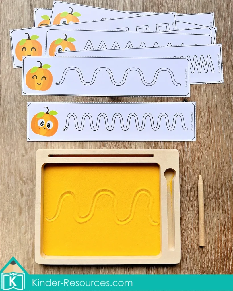 Pumpkin pre-writing tracing cards for preschool with wavy and zig-zag lines used for pencil control practice.