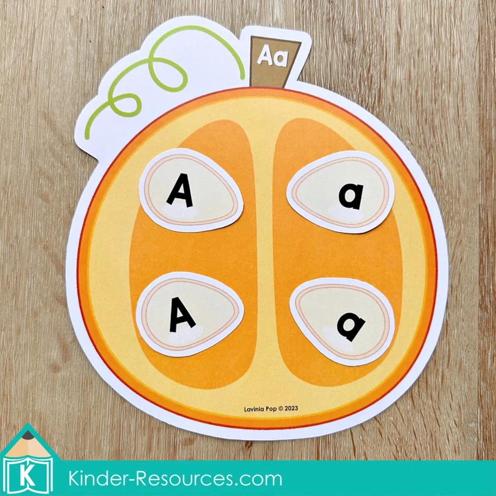 Pumpkin letter matching activity for preschool where uppercase and lowercase letters are matched using pumpkin seeds.