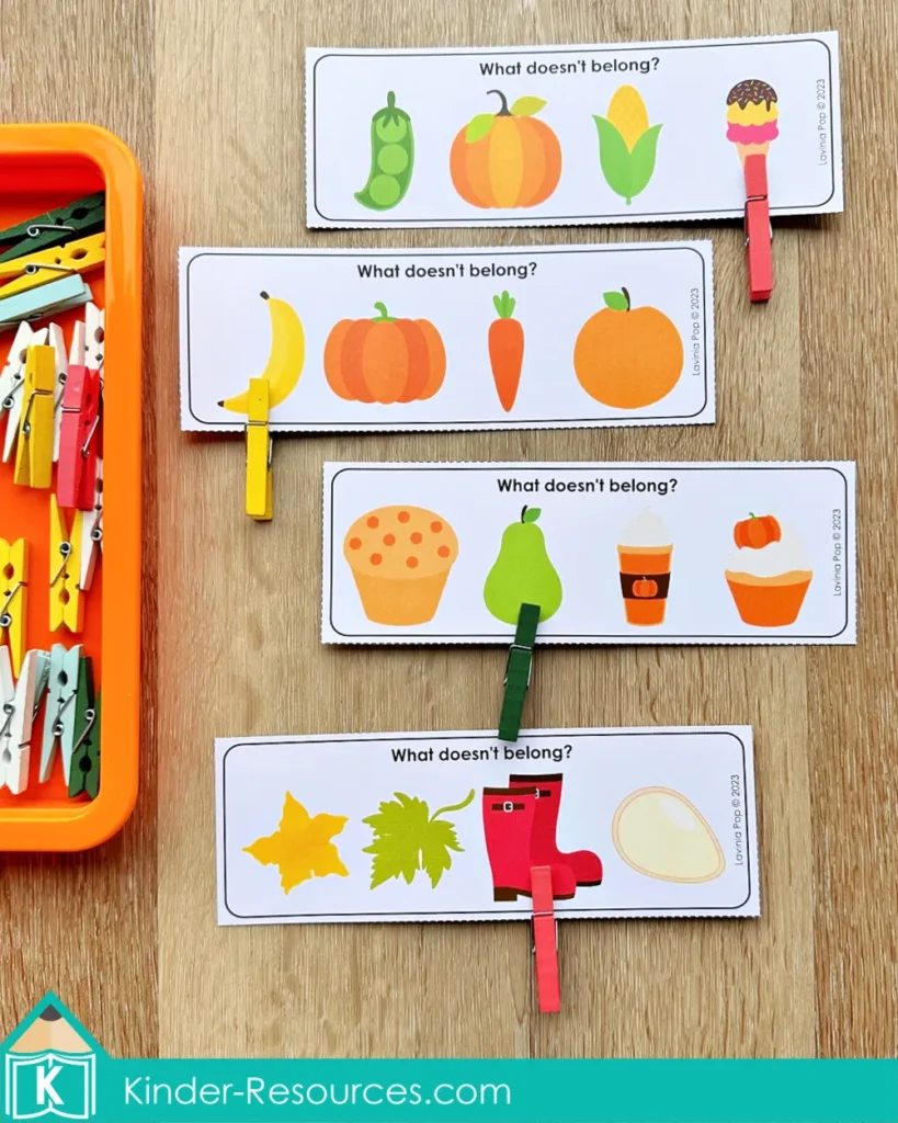 Pumpkin themed “What Doesn’t Belong?” activity cards for preschool with clothespins, helping children practice categorization and reasoning.