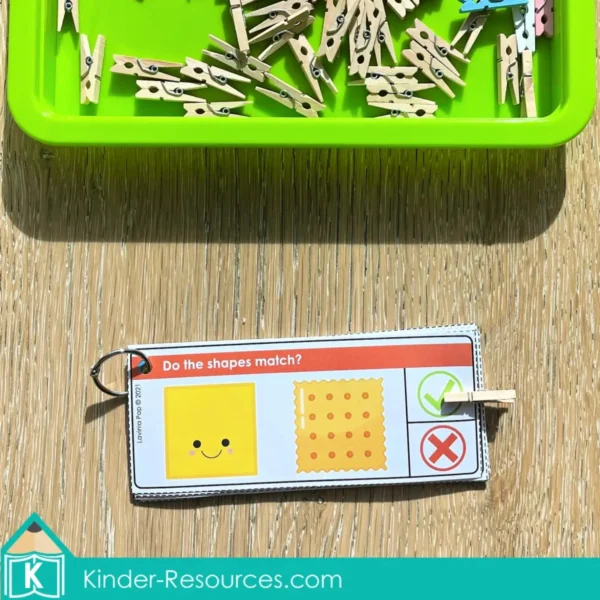 Printable 2D shape recognition task card showing a square and cracker match with a clothespin clip