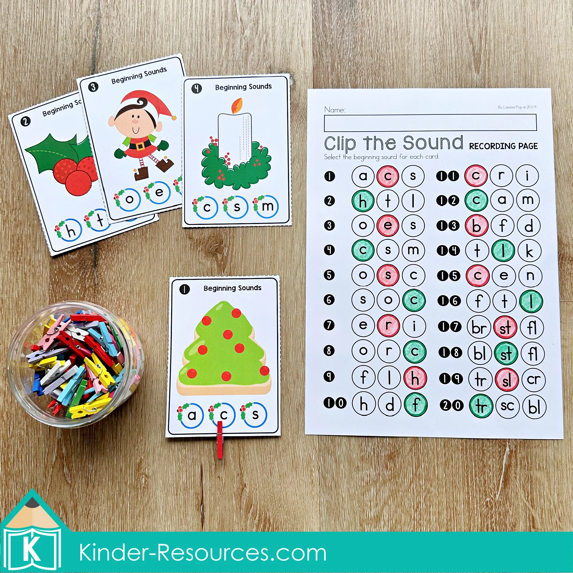 Christmas Literacy Centers for Kindergarten Beginning Sounds Clip Cards Christmas Literacy Centers for Kindergarten beginning sounds activity with holiday clip cards and recording page for identifying initial sounds.