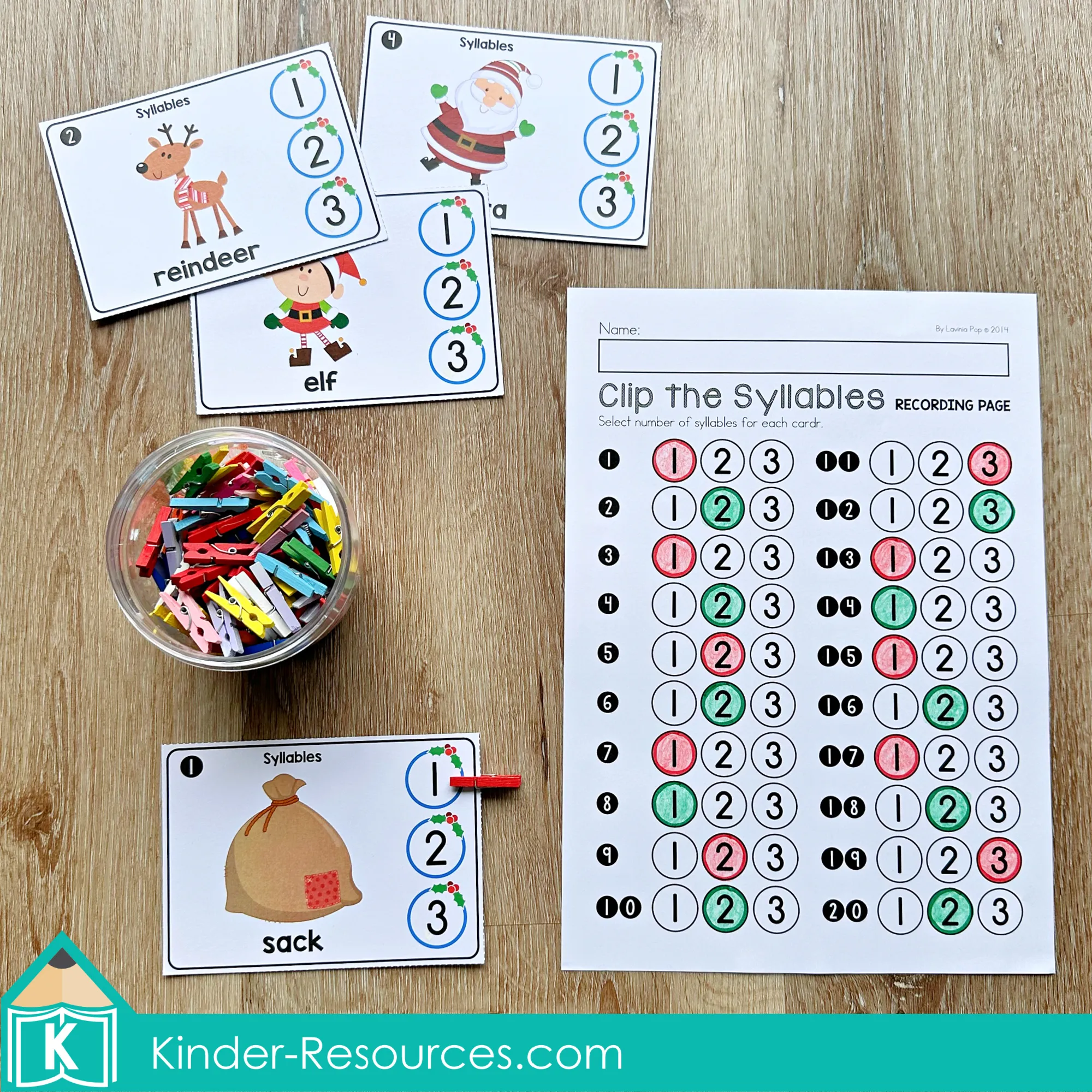 Christmas Literacy Centers for Kindergarten Syllable Clip Cards Christmas Literacy Centers for Kindergarten syllable counting activity with clip cards and recording page for selecting the number of syllables.