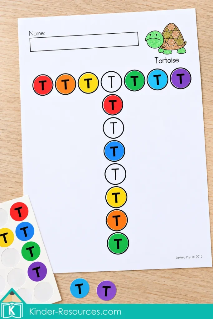Uppercase T dot marker page with rainbow stickers printed with the letter T and a colored tortoise illustration.