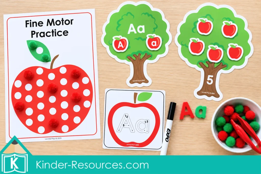 Apple centers for preschool featuring a pom pom mat, Aa letter matching tree, number 5 counting tree, and alphabet tracing card.