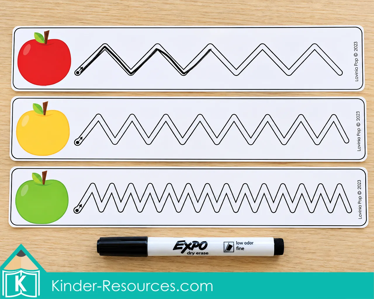 Apple centers for preschool with three zigzag tracing cards, red, yellow, and green apple pictures, and a dry erase marker.