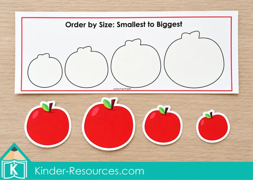 Apple centers for preschool with four differently sized red apple pieces below a sorting mat with outlines increasing from smallest to biggest.