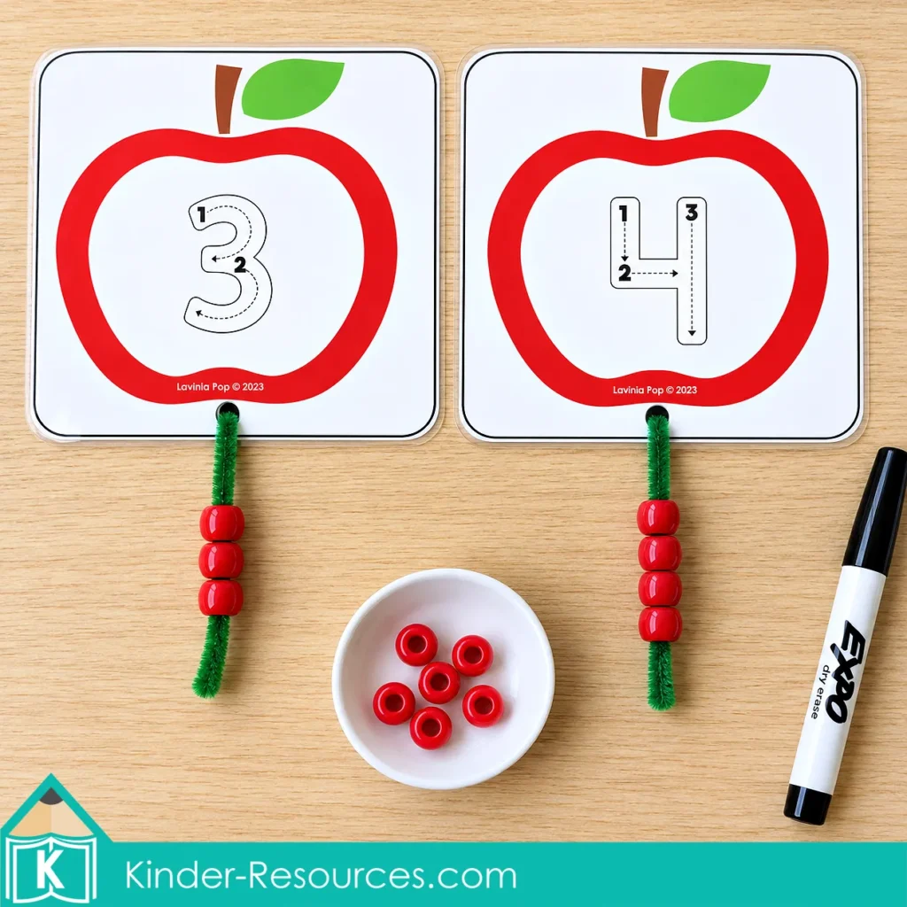 Apple centers for preschool with number 3 and 4 tracing cards, matching sets of red beads on green pipe cleaners, and a dry erase marker.