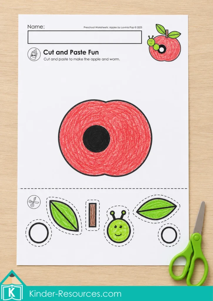 Apple cut-and-glue worksheet with an apple core and pieces for a preschool fine motor activity.