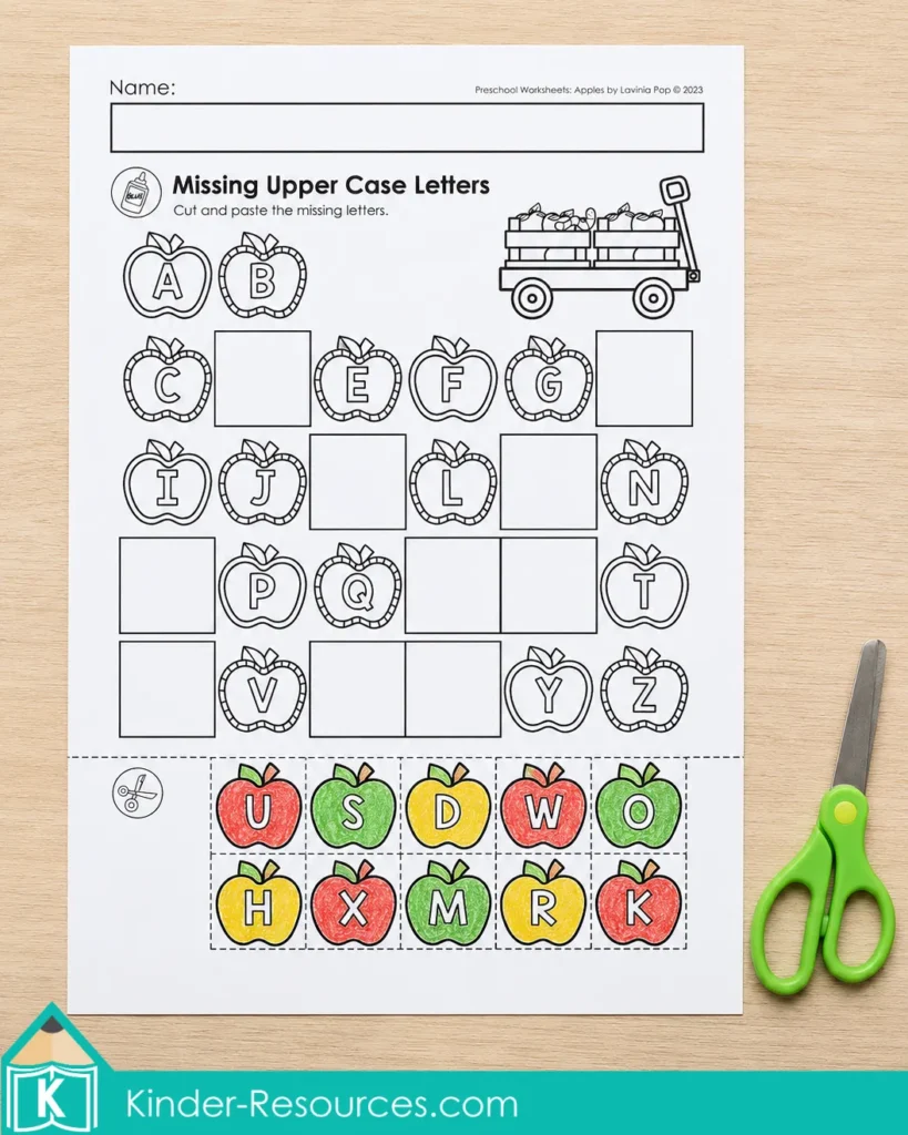 Apple alphabet worksheet for writing missing uppercase letters with colorful lowercase letter clues.
