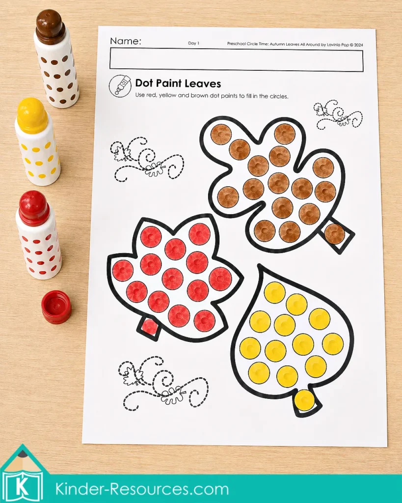 Autumn leaves preschool activities dot marker worksheet with three leaf pictures filled using red, yellow and brown bingo dabbers.
