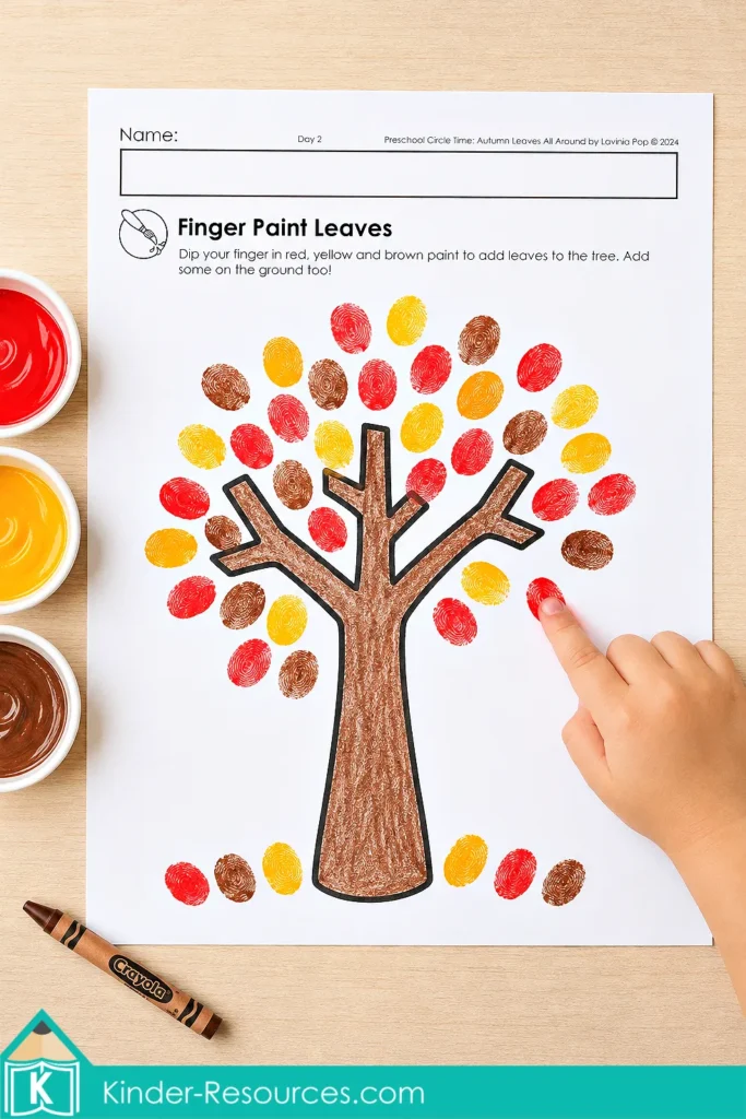 Autumn leaves preschool activities finger painting page with a fall tree covered in red, yellow, orange and brown fingerprint leaves.