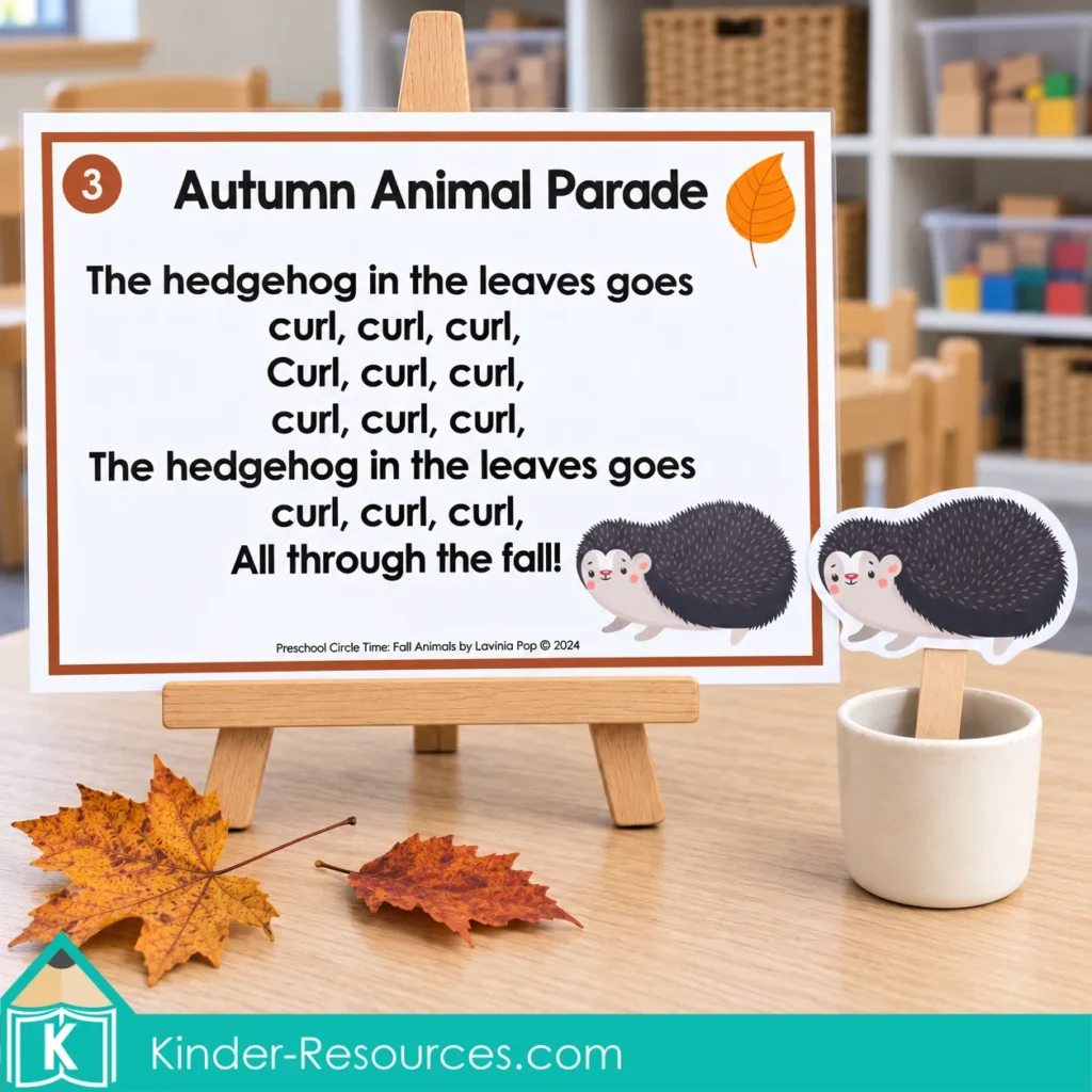 Preschool hedgehog song poster with repeated “curl” lyrics, displayed on an easel beside a hedgehog stick puppet and fall leaves.