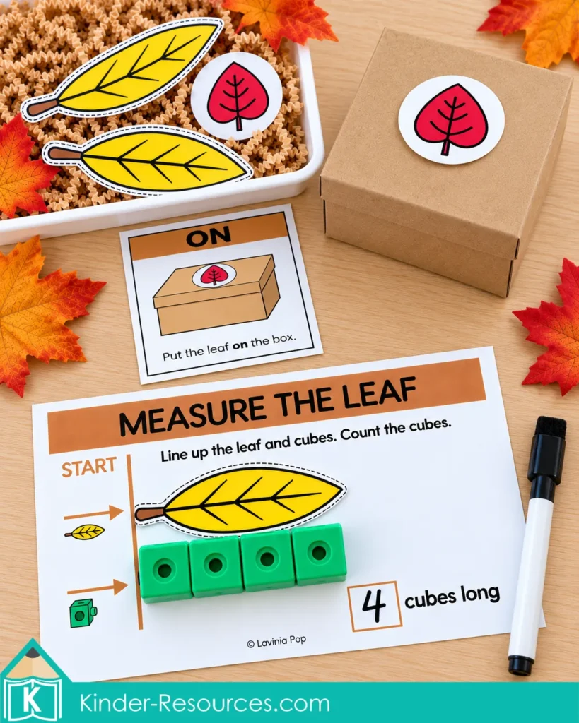 Preschool measurement and positional word activities with a yellow leaf above four linking cubes and a red leaf on a box beside an “on” direction card.