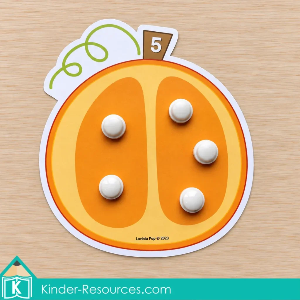Pumpkin centers for preschool with numbered pumpkin mats and counters to practice counting each object once and matching quantities to numerals.
