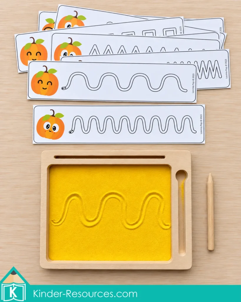 Pumpkin centers for preschool with line cards and a sand tray to practice prewriting strokes and develop control for handwriting.