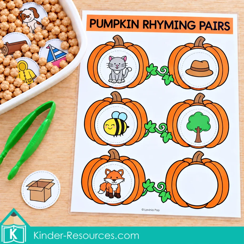 Pumpkin sensory bin for preschool with rhyming picture pairs for practicing rhyming words, phonological awareness, and early literacy skills.