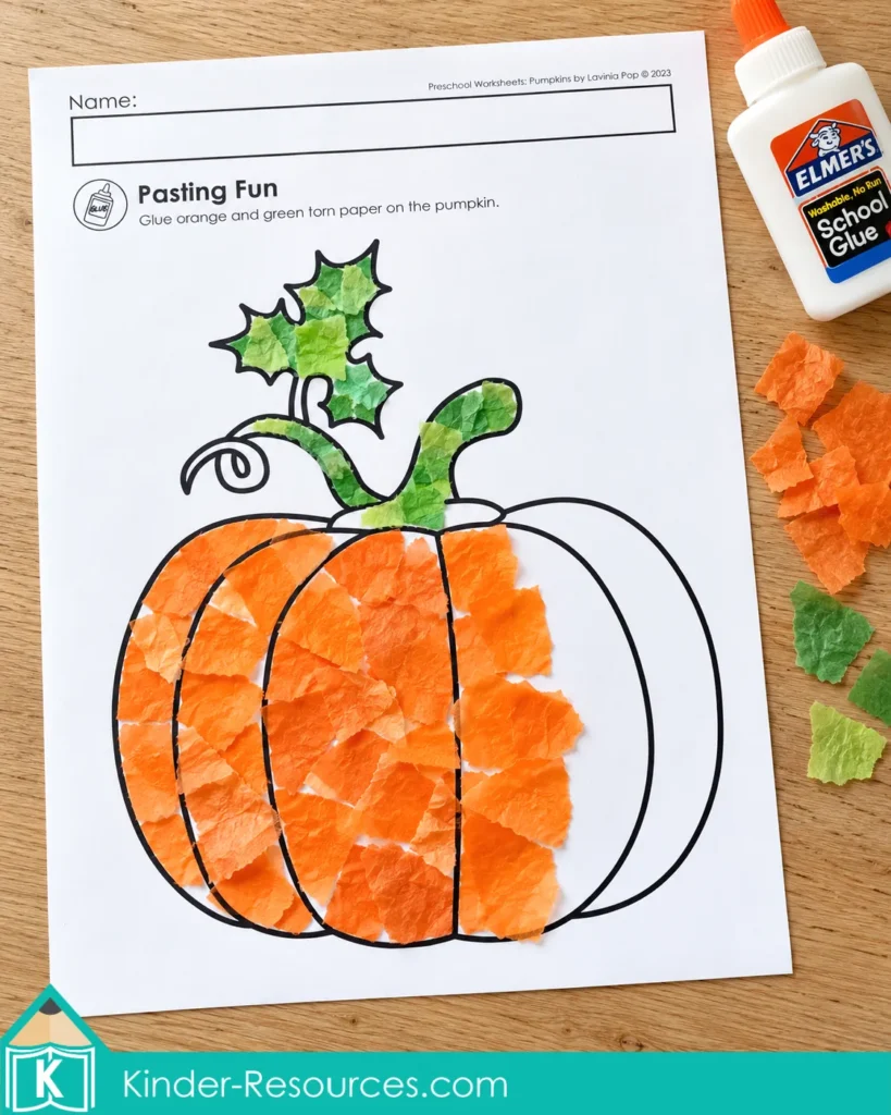 Pumpkin worksheets for preschool with orange and green tissue paper pasted onto a pumpkin for fine motor practice.