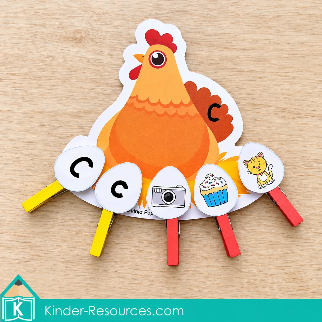 Chicken labeled C with clothespin eggs showing uppercase and lowercase C and pictures of a camera, cupcake, and cat.