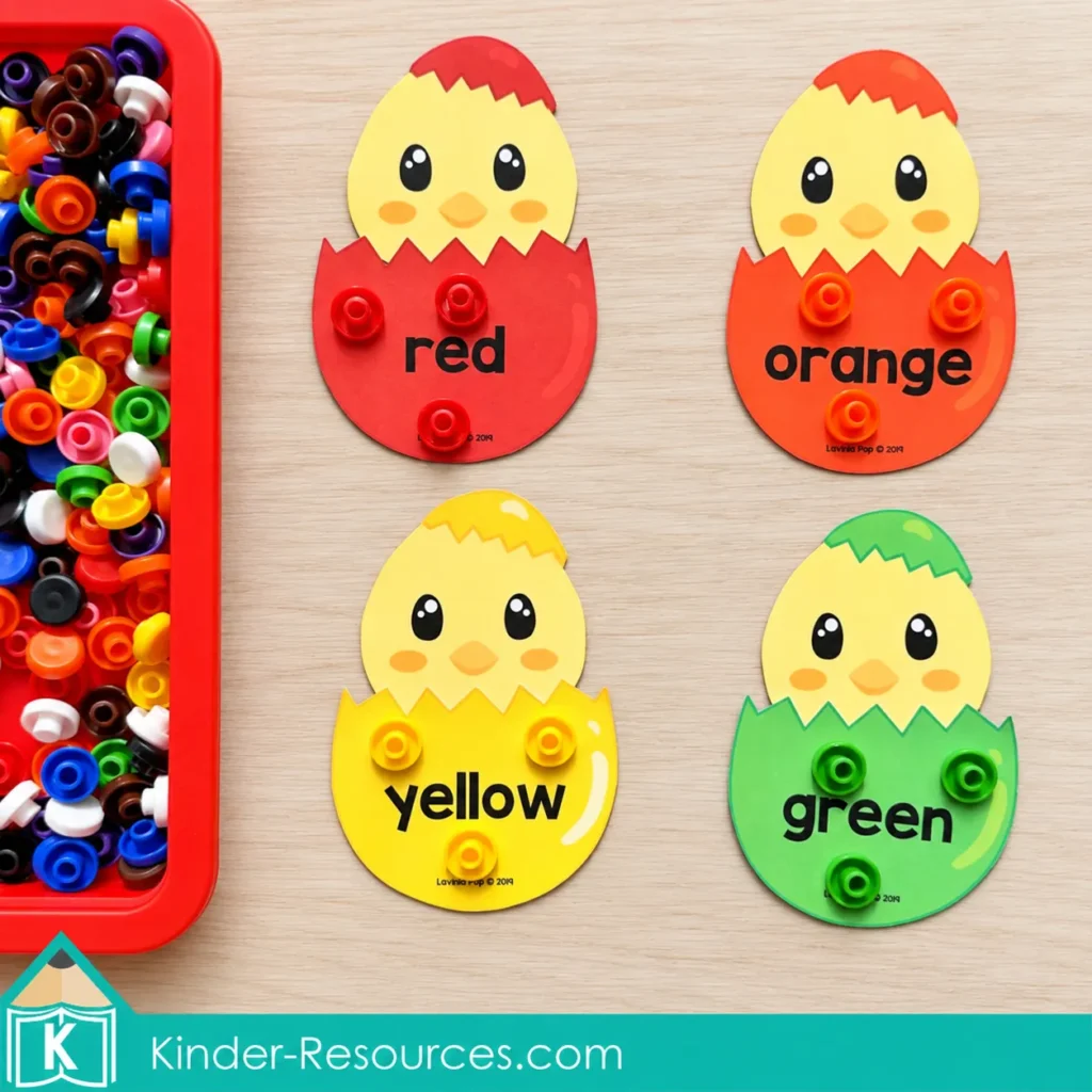 Red, orange, yellow, and green chick cards each hold three matching counters beside a tray of colorful counters.