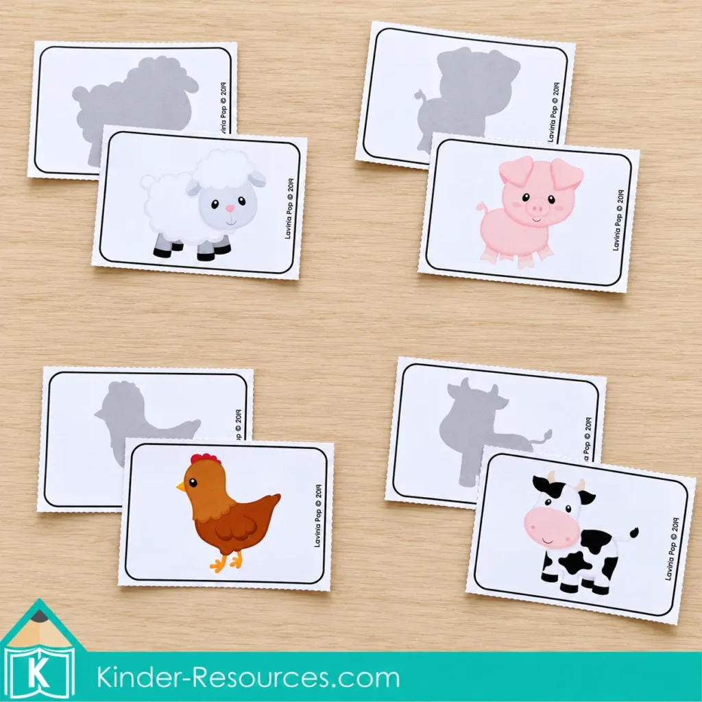 Picture cards of a sheep, pig, hen, and cow are paired with their matching gray silhouette cards.